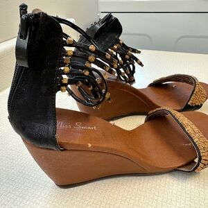Sandals.. black and tan leather with zip heel